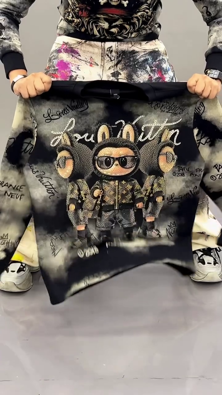 Black and Grey Cloud Wash Graphic Sweatshirt with Cartoon Trio Front Print and Abstract Script Background Design