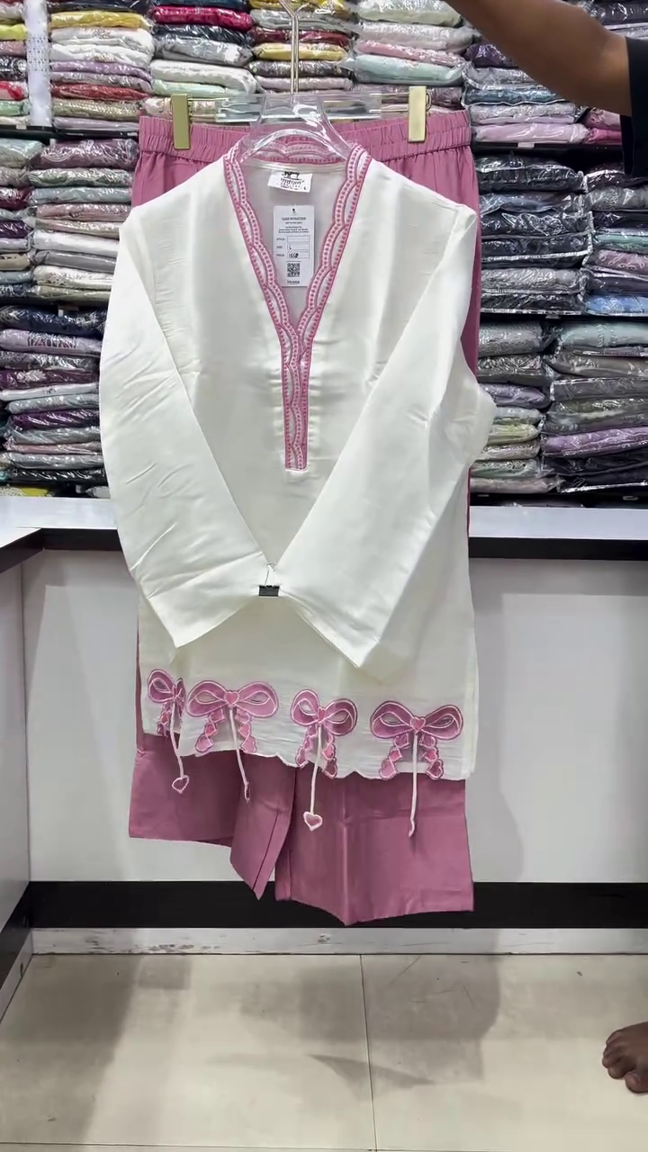 Elegant White Traditional Kurti With Intricate Pink Neckline Embroidery And Pink Bow Hem Details 🤍🩷🎀