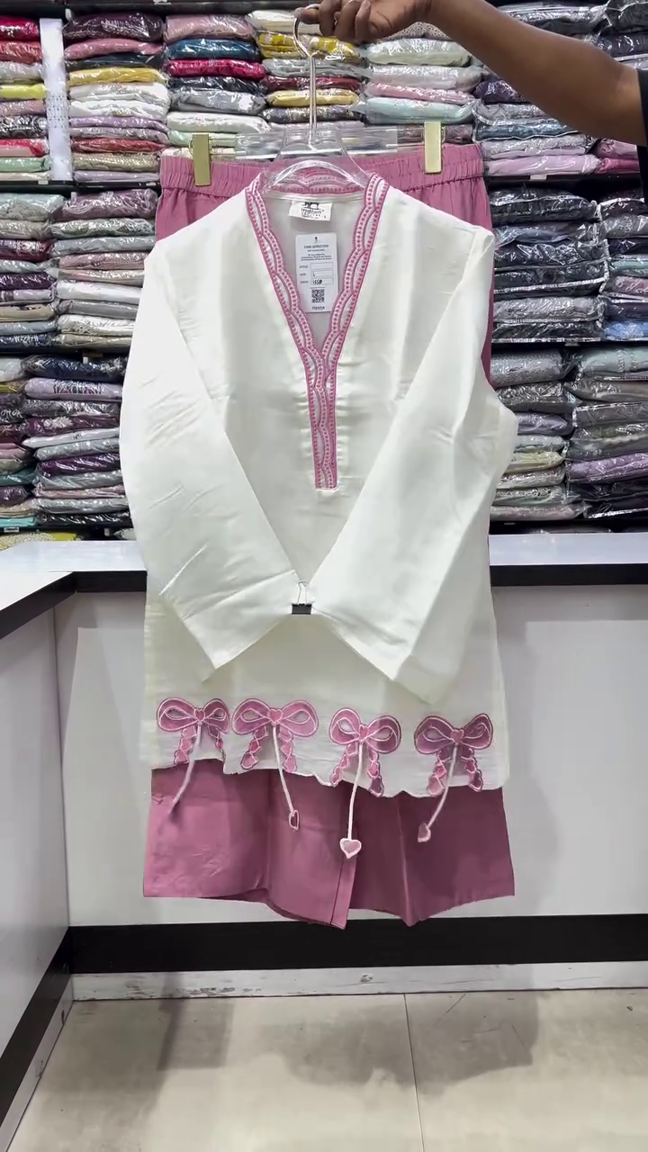Elegant White Traditional Kurti With Intricate Pink Neckline Embroidery And Pink Bow Hem Details 🤍🩷🎀